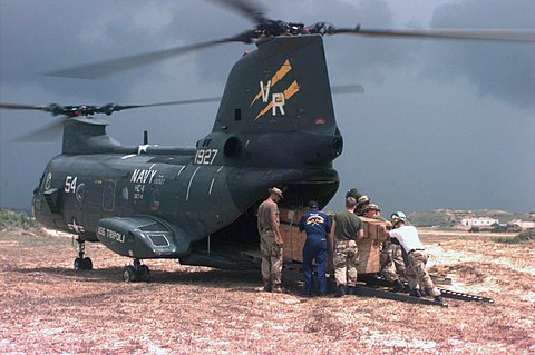 UN troops loading supplies onto a helicopter